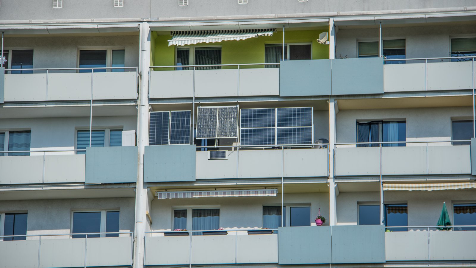 Solar panels mounted on balconies of a large block of flats in Leipzig