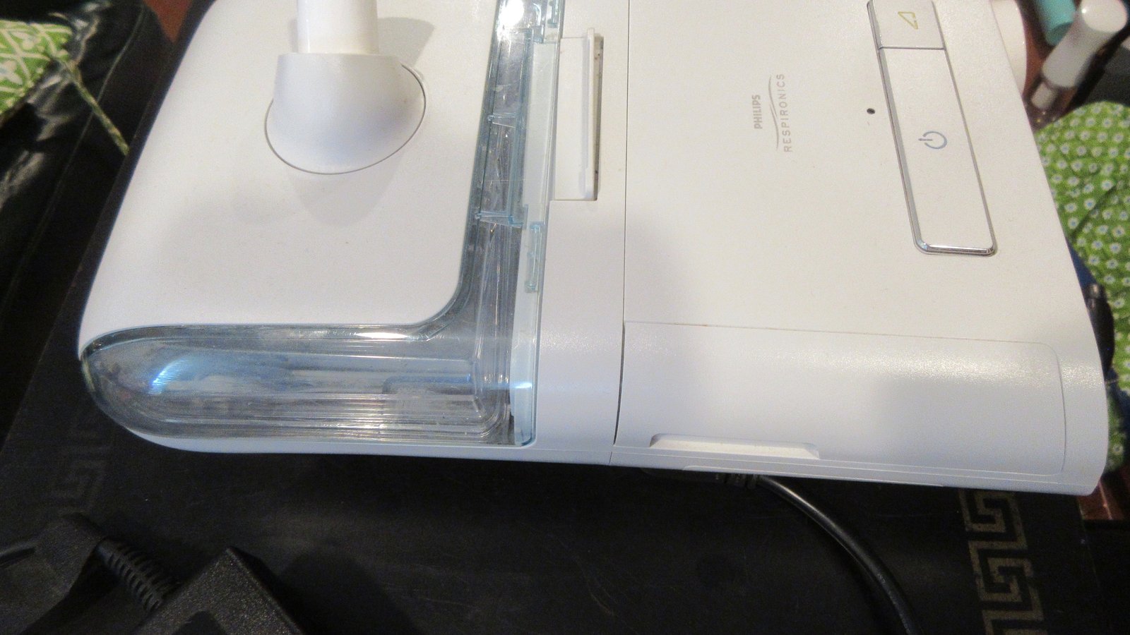 A Philips DreamStation CPAP machine with its water chamber