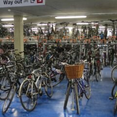 Rows of bicycles in a two-tier cycle park by Cambridge railway station