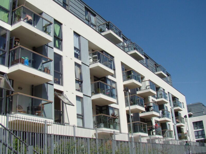 A modern block of flats with balconies beside the Regent's Canal in London