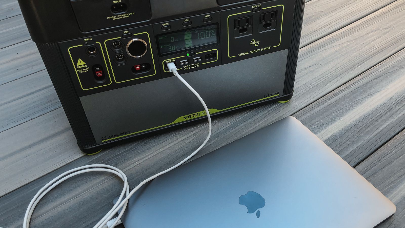 A Goal Zero Yeti 1400 portable power station charging a laptop through a USB-C cable