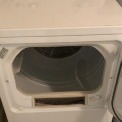 A white tumble dryer with its door open