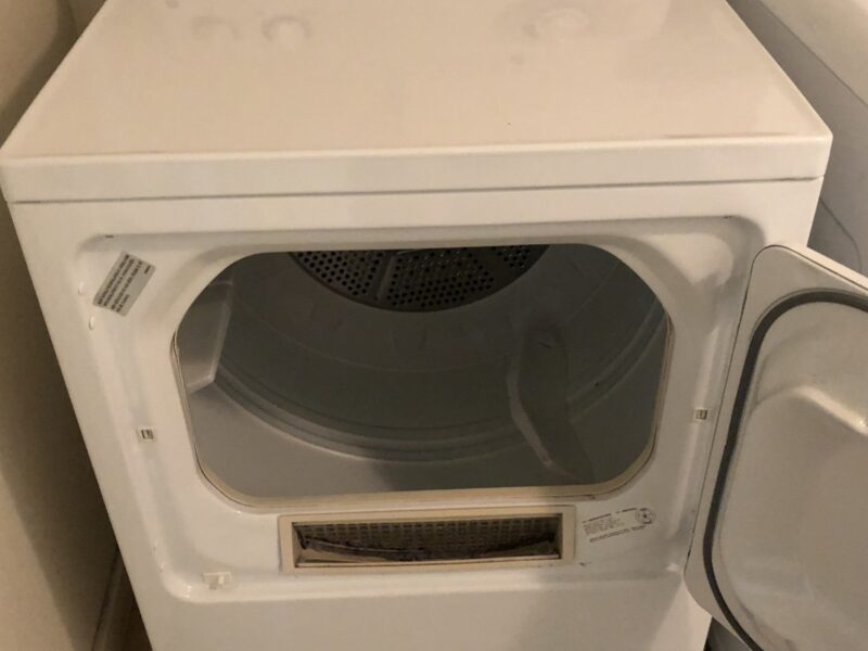 A white tumble dryer with its door open