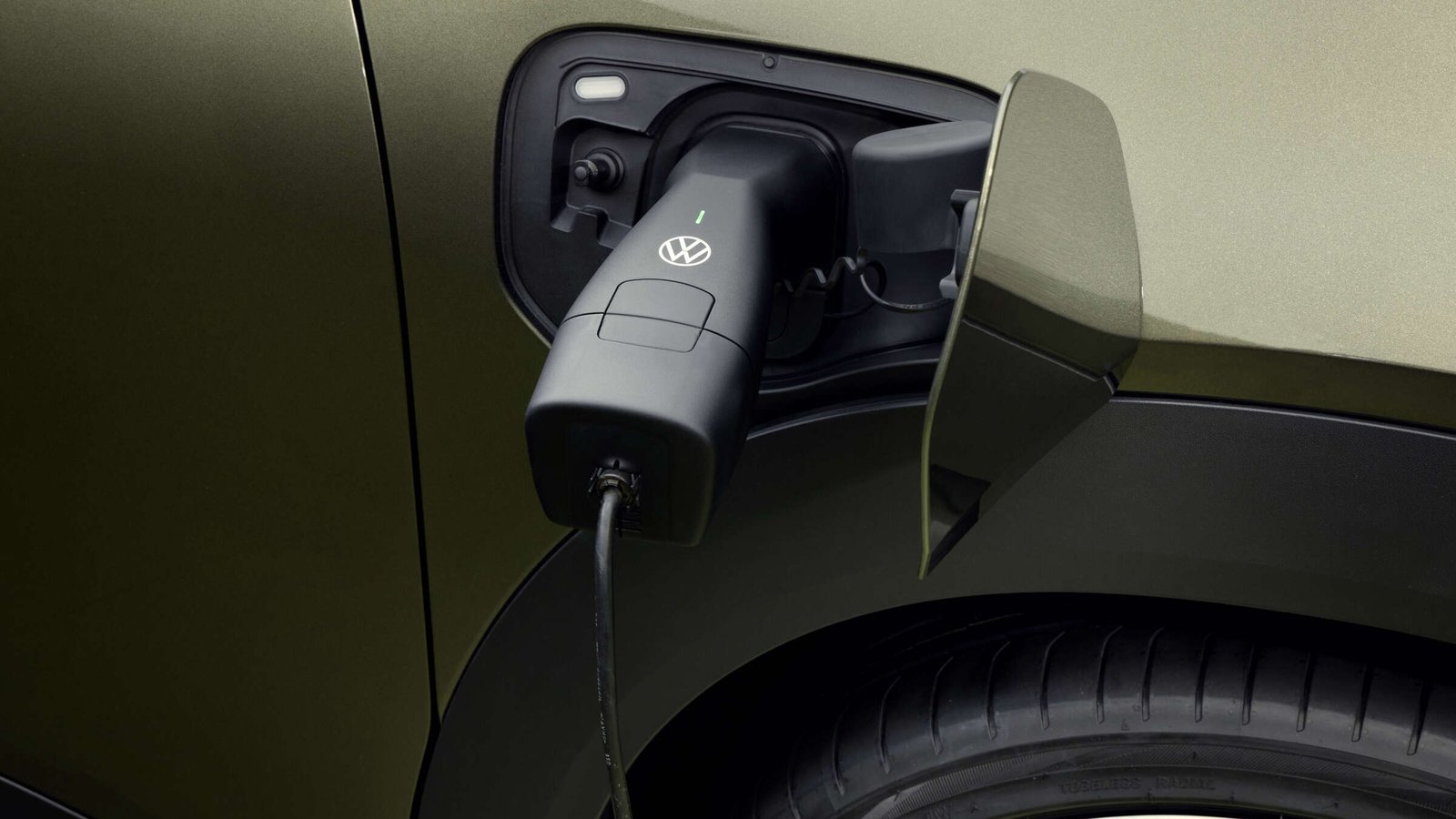A charging plug connected to the side charge port of an electric car