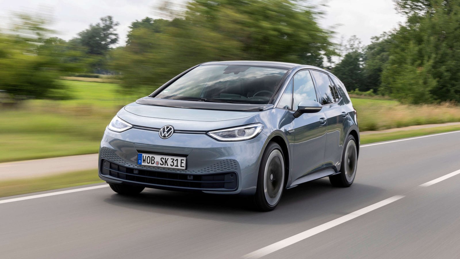 A first-generation Volkswagen ID.3 electric hatchback on the road